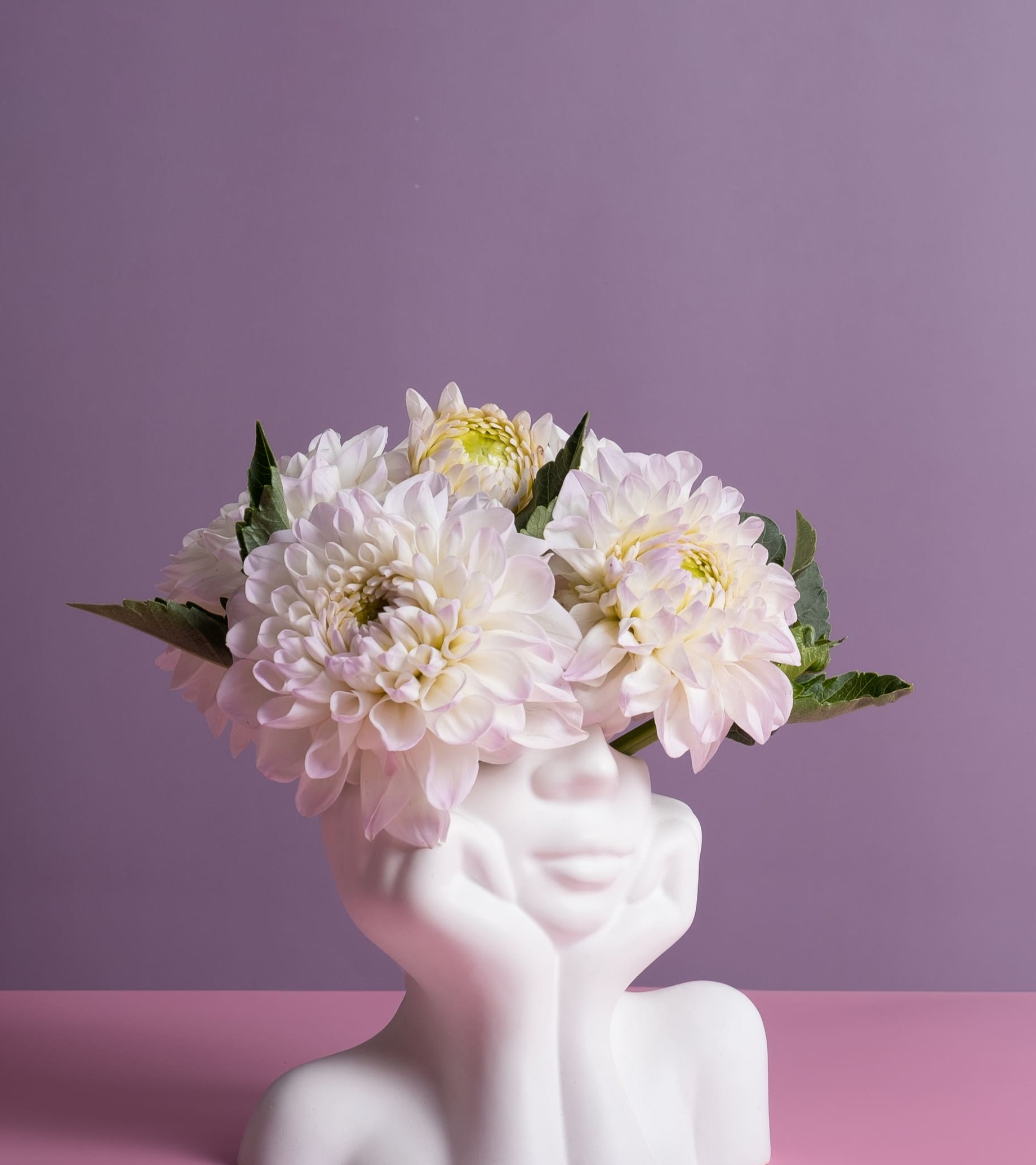plaster-head-with-flowers-on-a-colored-background-2025-06-05-16-00-59-utc
